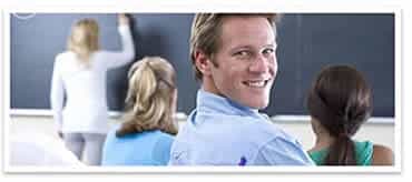 a smiling male student in a TEFL classroom